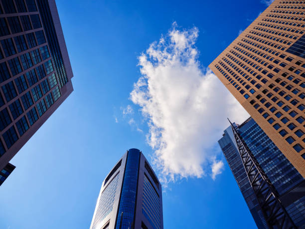Tokyo skyscraper buildings in the downtown area, under a clear blue sky on a sunny day.