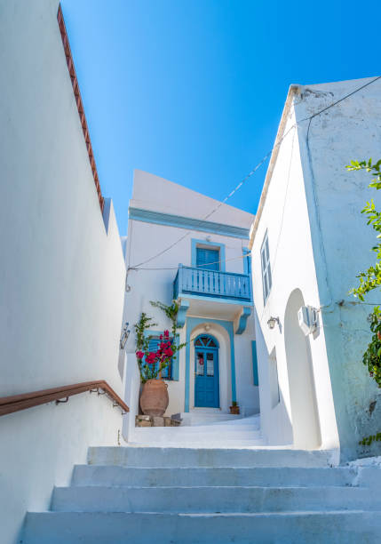 istock The typical cycladic, whitewashed alleys with colorful flowers 1185430373