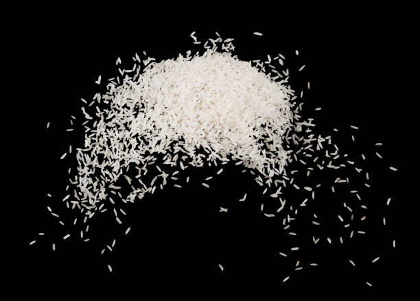 istock Stop motion white rice splash or explodsion flying in the air  isolated on black background food object design 1185430679