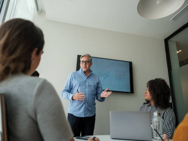istock Latin senior manager having meeting with team 1185430872