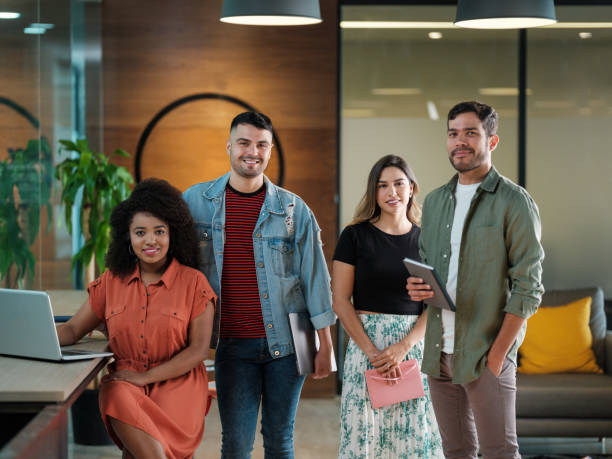 istock Group of young latin people smiling at camera in open space 1185430883