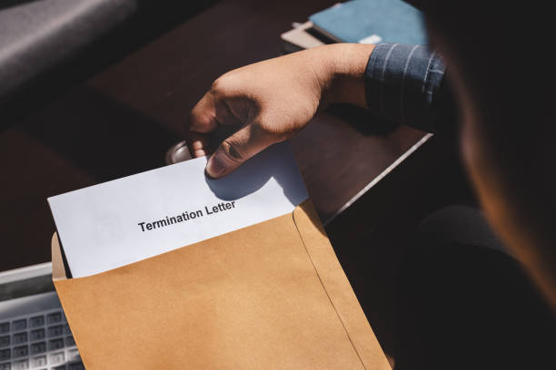 Termination of Employment and layoff concept Termination of Employment and layoff concept, Stressed businessman feeling down after received Termination of Employment Form in paper brown envelope. being fired stock pictures, royalty-free photos & images