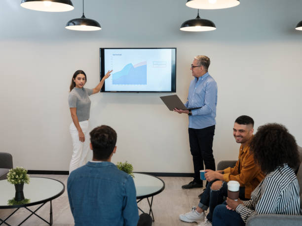 istock Business people during presentation in coworking space 1185430898