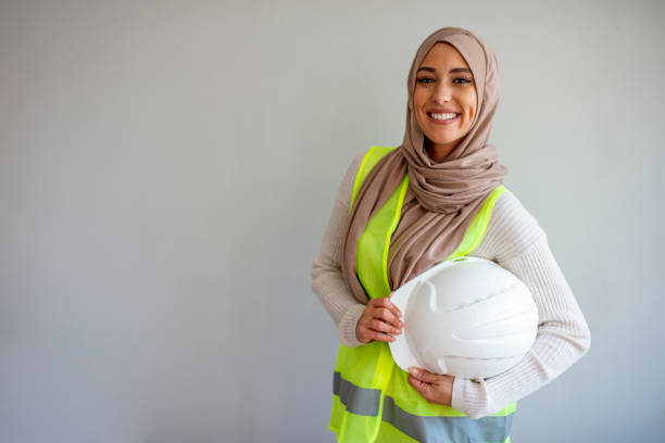 istock Engineer woman Hold blue print architects at construction site 1185431629