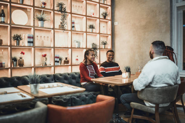 istock Two diverse couples, gathering in the restaurant 1185431686