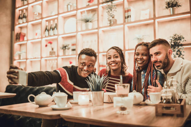 istock Two diverse couples, gathering in the restaurant. 1185431728