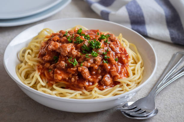 Spaghetti bolognese in white bowl Spaghetti bolognese in white bowl Spaghetti with Meat Sauce stock pictures, royalty-free photos & images