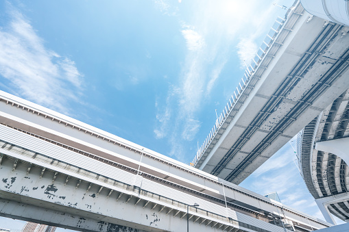 Two sturdy columns are positioned side by side, forming a strong and symmetrical presence. These architectural elements are part of a bridge structure in Gothenburg, Sweden.