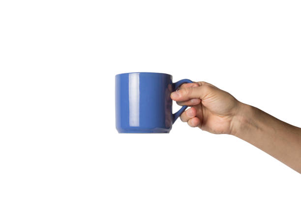 istock Male hand holding a blue cup with hot coffee on a white background. Side view 1185435599