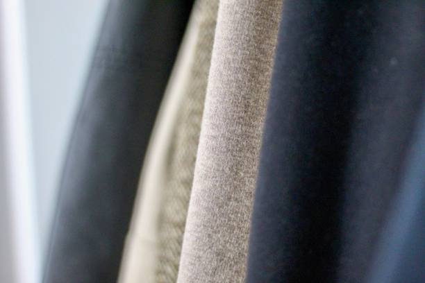 istock A rack of winter coats in a closet 1185437122