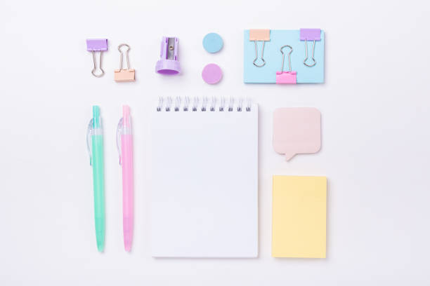 istock School background with notebook and pastel colorful study accessories Back to school concept 1185438796