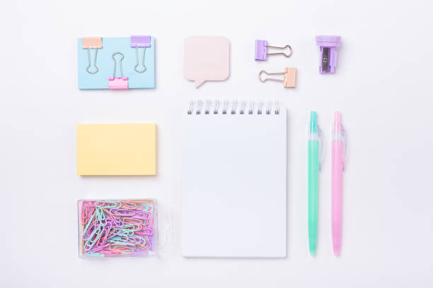 istock School background with notebook and pastel colorful study accessories Back to school concept 1185438832