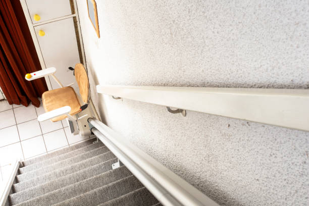 istock Automatic stair lift on staircase taking elderly people and disabled persons up and down in a house 1185438953