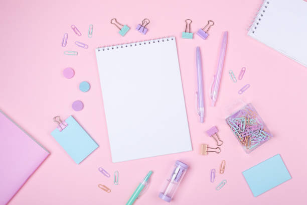 istock School background with notebooks and pastel colorful study accessories on pink background Back to school concept 1185439225