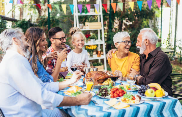 istock Happy family celebrating Thanksgiving day 1185440030