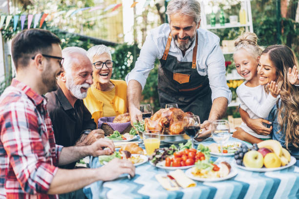 istock Happy family celebrating Thanksgiving day 1185440032