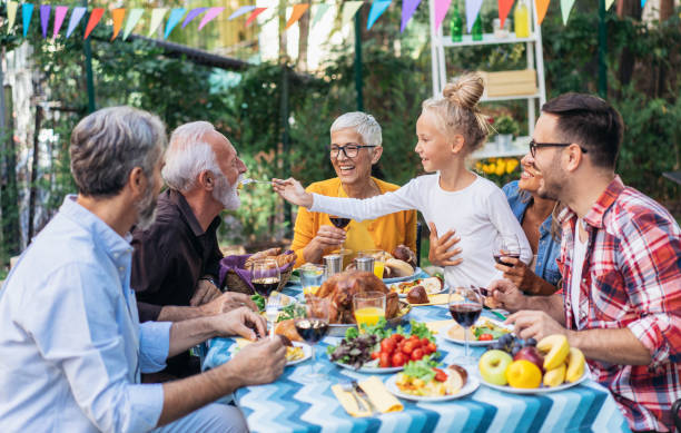 istock Happy family celebrating Thanksgiving day 1185440034
