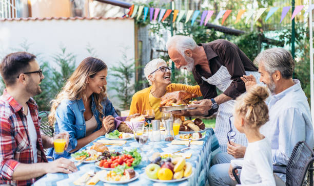 istock Happy family celebrating Thanksgiving day 1185440049