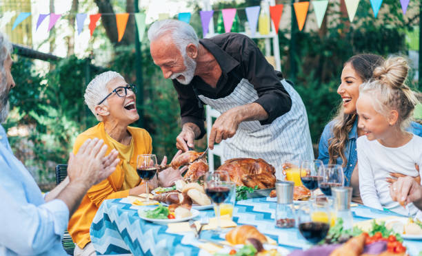 istock Happy family celebrating Thanksgiving day 1185440055