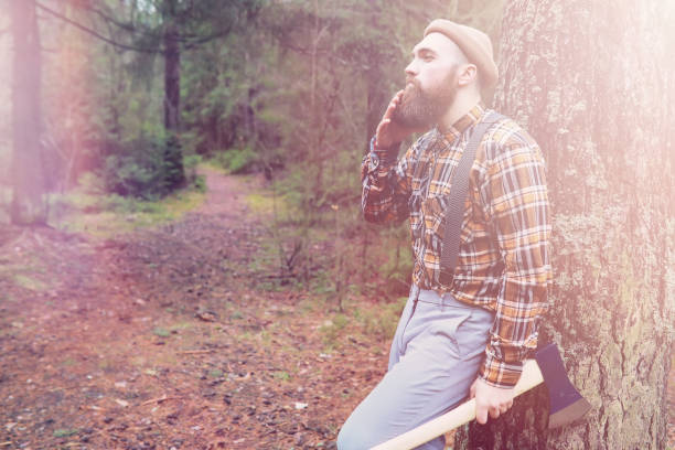 istock A bearded lumberjack with a large ax 1185440742
