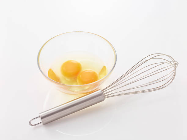 istock eggs, whisk, flour and rolling pin in the white background 1185441473