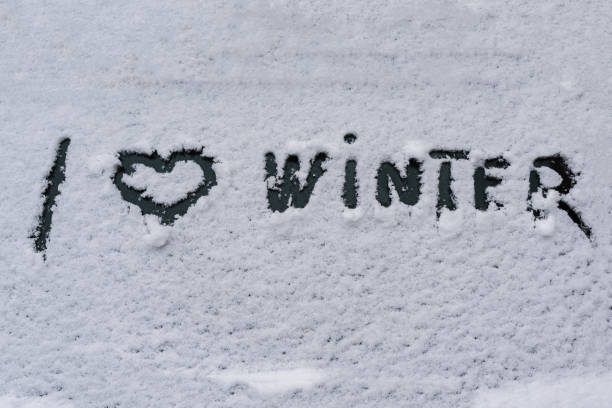 istock I love winter phrase on the car window. Winter concept 1185442137