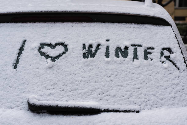 istock I love winter phrase on the car window. Winter concept 1185442164