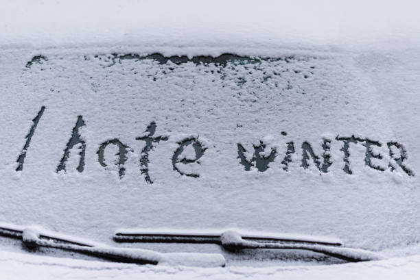 istock I hate winter phrase on the car window. Winter negative, concept 1185442290