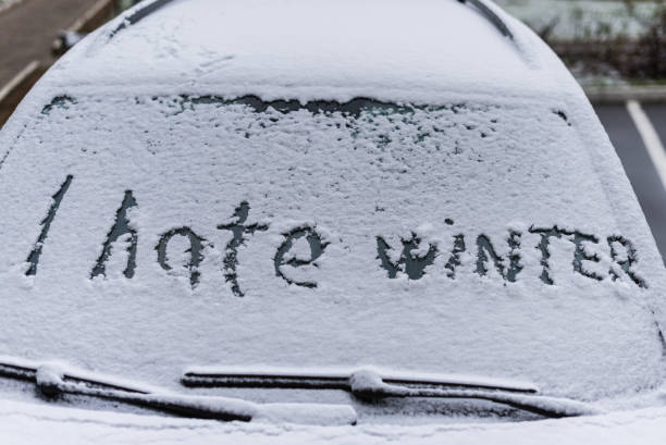 istock I hate winter phrase on the car window. Winter negative, concept 1185442408