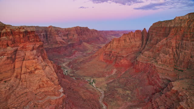 AERIAL Above the Grand Canyon as the sun is setting