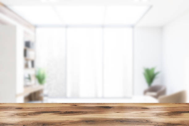 istock Blurred white and wooden office with lounge 1185444226