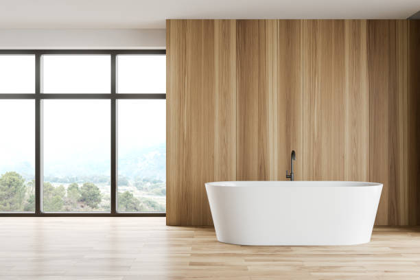istock Wooden bathroom interior with tub 1185444656