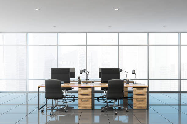 istock Panoramic office interior with wooden tables 1185445519