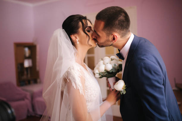 istock First look of groom and bride at home. Emotions 1185448098