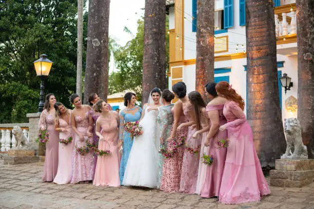 Bridesmaid and bride taking a photo together