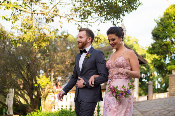 Groomsman and bridesmaid entering at wedding ceremony