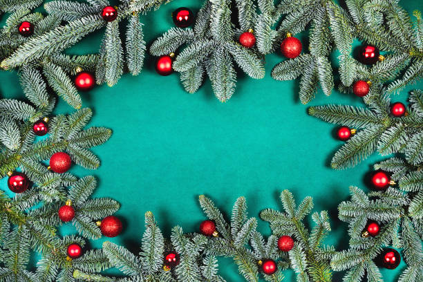 istock Christmas background with fir branches and red balls. 1185448984