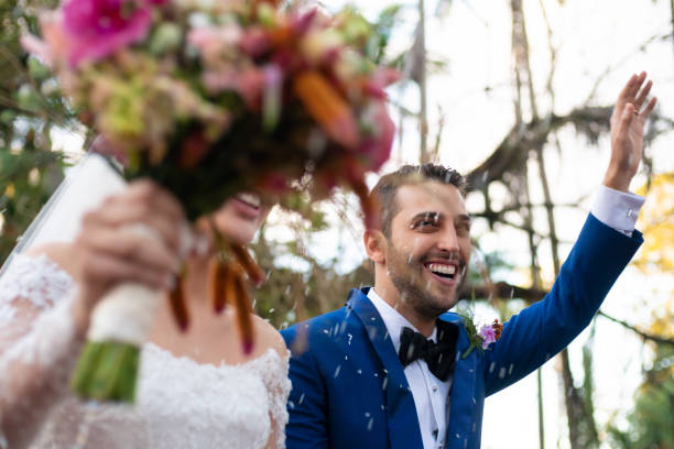 istock Confetti throwing on happy newlywed couple 1185448988