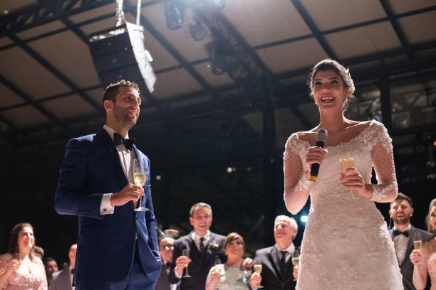 istock Newlyweds talking on wedding party 1185449101