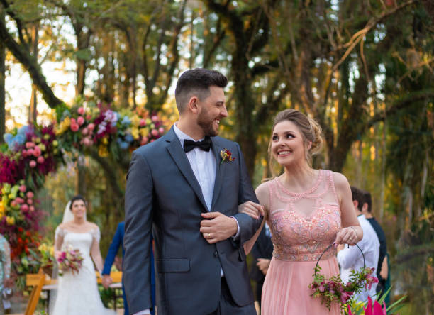 istock Groomsman and bridesmaid leaving at wedding ceremony 1185449364