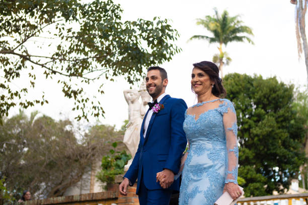 istock Groom and his mother entering in wedding ceremony 1185449598