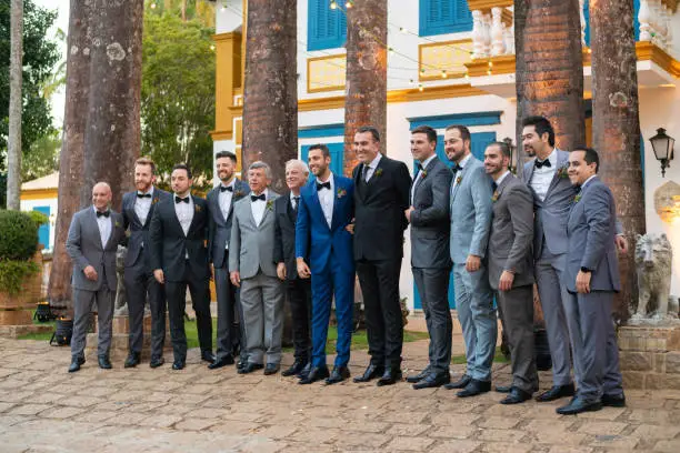 Groomsmen taking a picture with groom
