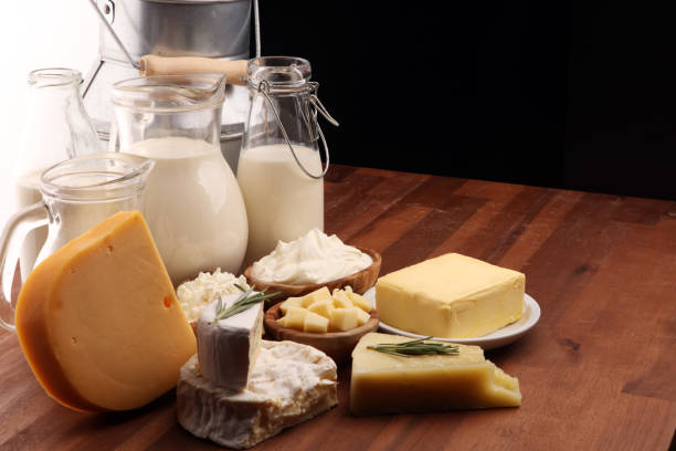 istock Different  healthy dairy products on rustic background with milk, cheese, butter and cottage 1185451330