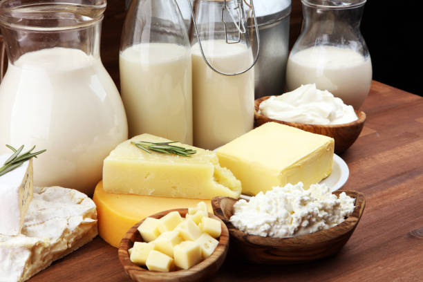istock Different  healthy dairy products on rustic background with milk, cheese, butter and cottage 1185451414