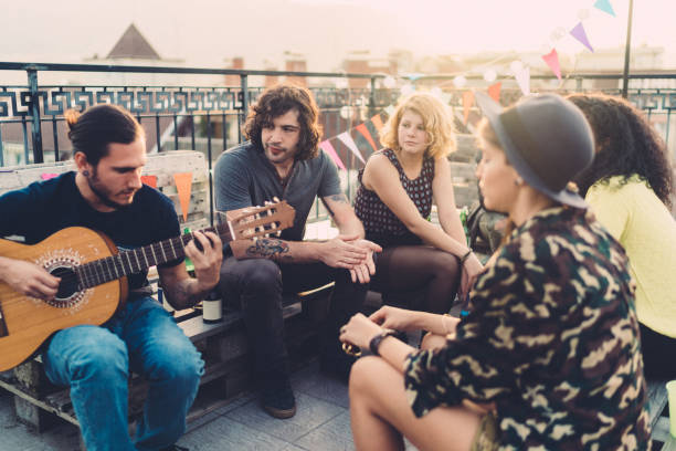 istock Friends on rooftop party 1185454835
