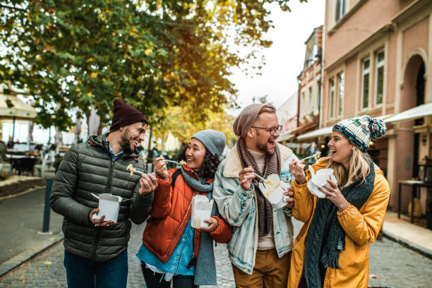 istock Friends eating pasta outdoors 1185455069
