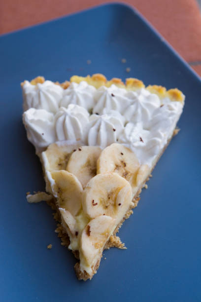 istock Banana tart with cream decoration on a rustic background 1185455725