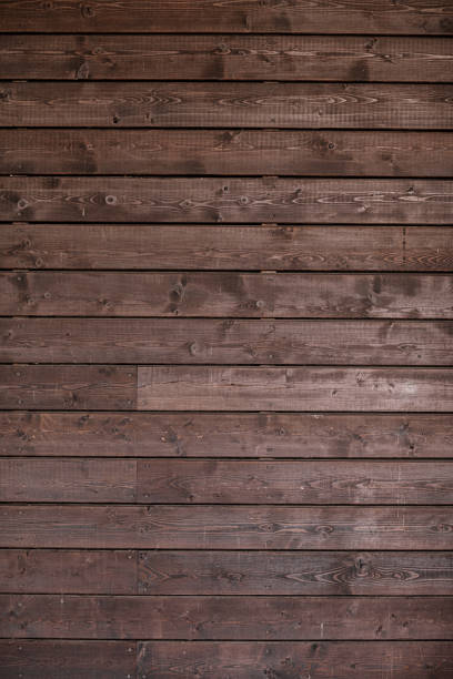 istock brown wood texture background, natural pattern. Close up wood planks texture background. 1185455802