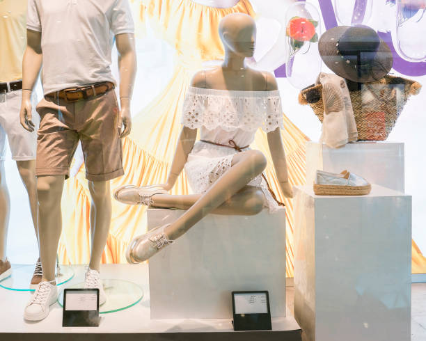 istock Mannequins on clothing store window display 1185456424