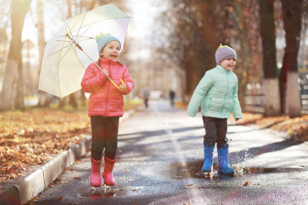 istock Children walk in the autumn park 1185457592